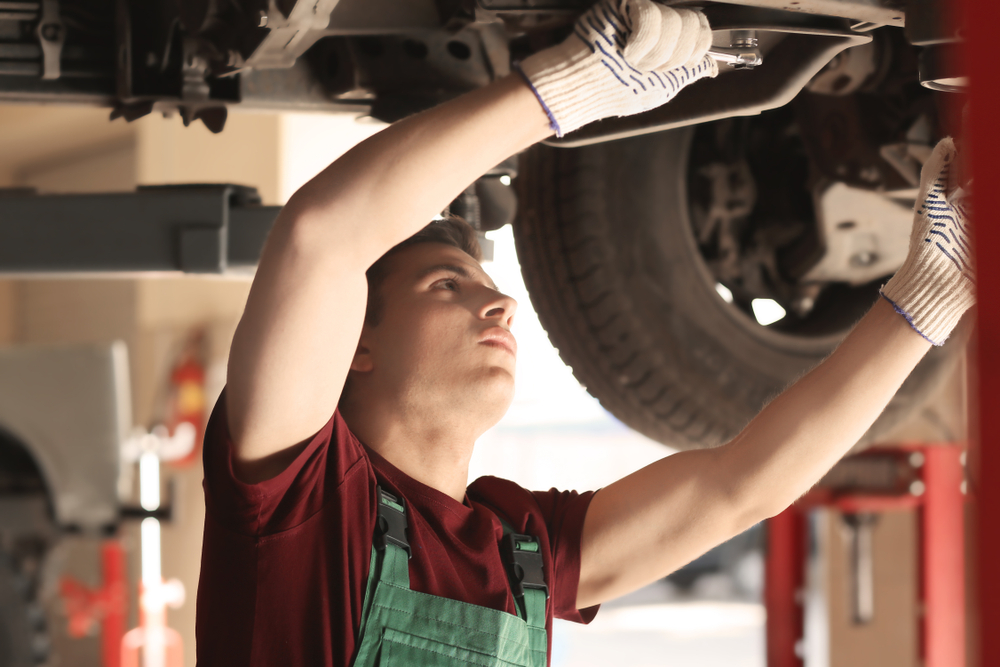 man working at an automotive service center in bucks county pa